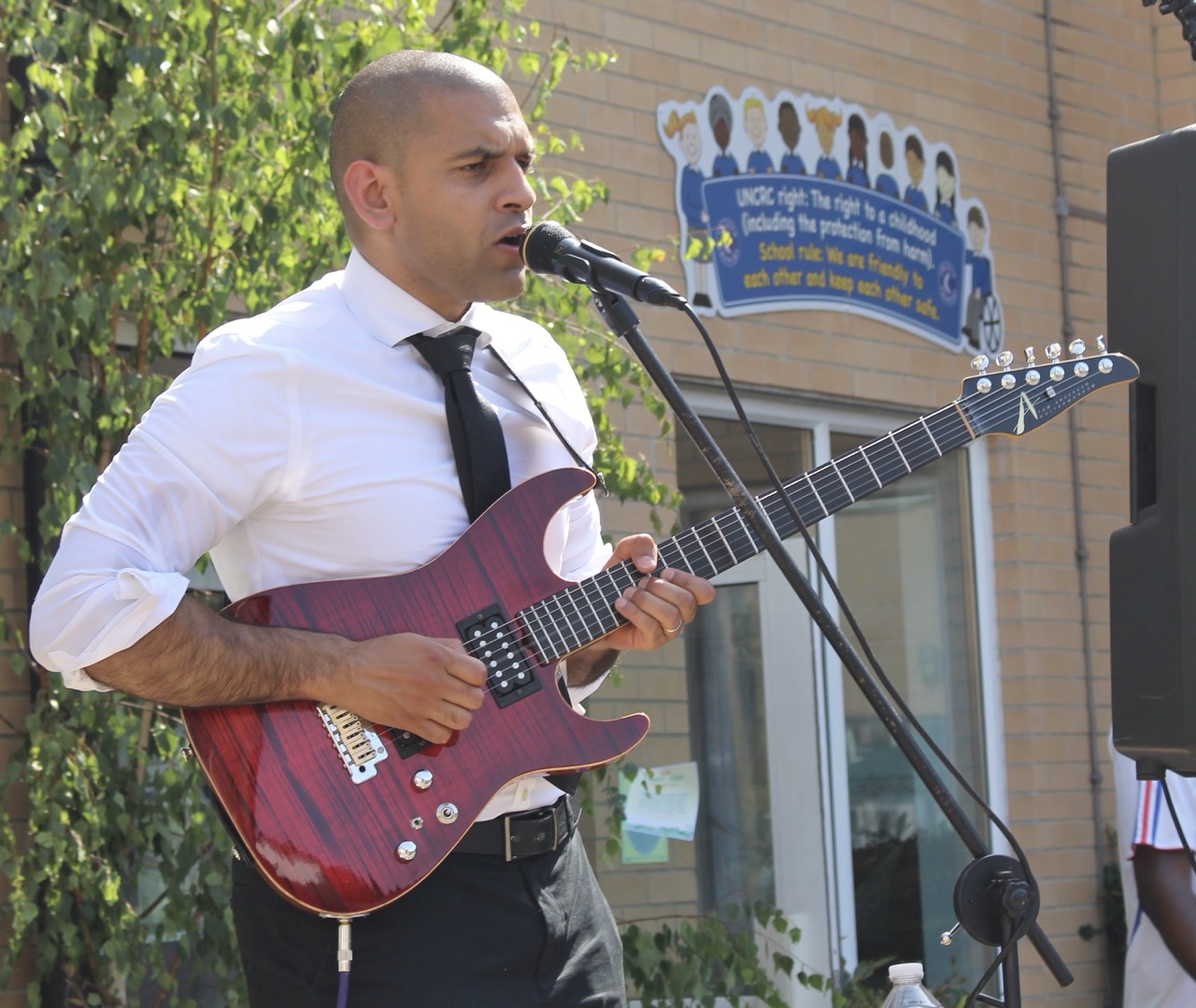 Rol performing at an outdoor summer party and school college festival